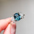 Flora - 2.45 Cts Cushion Teal Sapphire Engagement Ring - Nolan and Vada