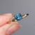 Sylvia  - 1.04ct Round Teal Sapphire Engagement Ring - [S828-SYLVIA-NVST2879]