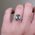S823-FLEUR-WG-NVST3828 - Ring on Hand