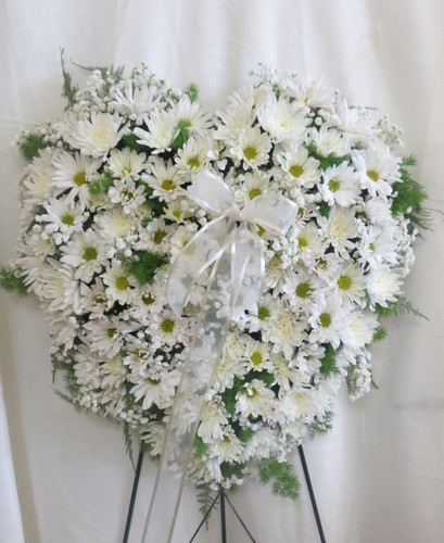 Purest Soul All White Heart Shaped Funeral Wreath from Sympathy Flower Shop. Our standing spray heart will arrive on a metal funeral easel and includes white daisies, white mums, and white baby's breath throughout the entire heart. Solid white heart is approximately 20" W x 22" H
SKU SYM112