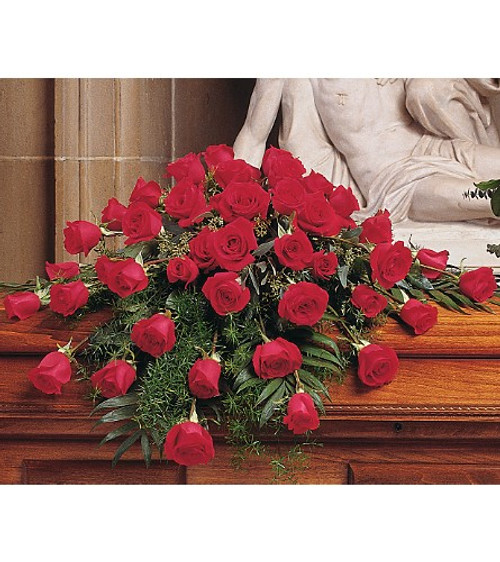 Small Red Rose Casket Cover Spray from Sympathy Flower Shop. Our classic casket spray arrives with forty-eight red roses arranged to gently fit on the caskets lid. 
SKU SYM820