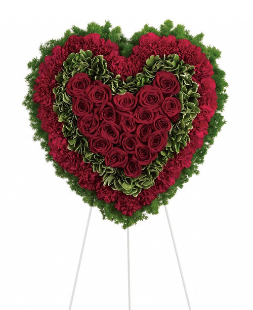 Eternal Love Red Heart Sympathy Spray from Sympathy Flower Shop. This solid red roses matched with deep red carnations are surrounded by variegated greens and fern and is delivered on a wire funeral easel. Approximately 21" W x 21" H (size does not include easel)
SKU SYM104