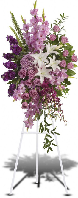 Gracious Gardens Standing Spray from Sympathy Flower Shop. Lavender, purple and white flowers like hydrangea, orchids, roses, oriental lilies and more create a beautiful spray. Bellaire funeral flower delivery. 
SKU SYM617