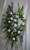 Large Crystal Cross Standing Spray from Enchanted Florist. This special spray includes blue hydrangea, white roses, white oriental lilies, white alstroemeria, bells of Ireland, blue delphinium, white snapdragons, eucalyptus, and and assorted greenery foliages. Delivered on a wire easel with a Large Crystal Cross Keepsake.
SKU 562