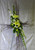 Lovely Birch Sympathy Cross by Enchanted Florist. This birch cross includes yellow lilies, white snaps, and yellow daisies and more for this sympathy floral delivery to funeral homes in Pearland TX. RM524