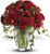 Red Rose Remembrance Bouquet by Sympathy Flower Shop. 
Over one dozen brilliant red roses and spray roses along with vibrant fern and ivy are perfectly arranged in an exclusive clear vase. Top Houston funeral florist. SKU SYM417