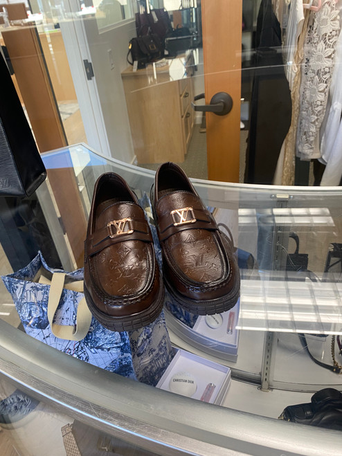 Louis Vuitton  embossed brown