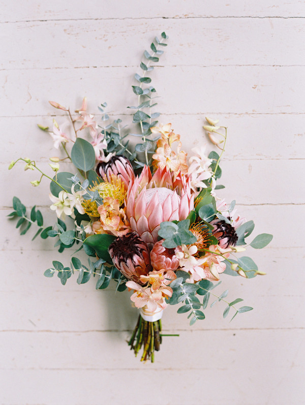 medium king protea bouquet image with a variety of flowers added and greenery.
