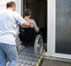 Wheelchair over threshold-sliding door