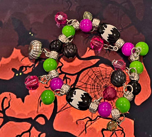 Painted Bat Charm Glass Beaded Stretch Bracelet. Painted Bat Charm Glass Beaded Stretch Bracelet.