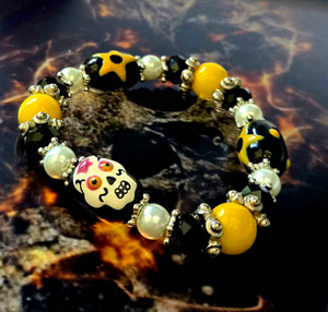 Painted Yellow Sugar Skull Glass Beaded Stretch Bracelet. Painted Yellow Sugar Skull Glass Beaded Stretch Bracelet.