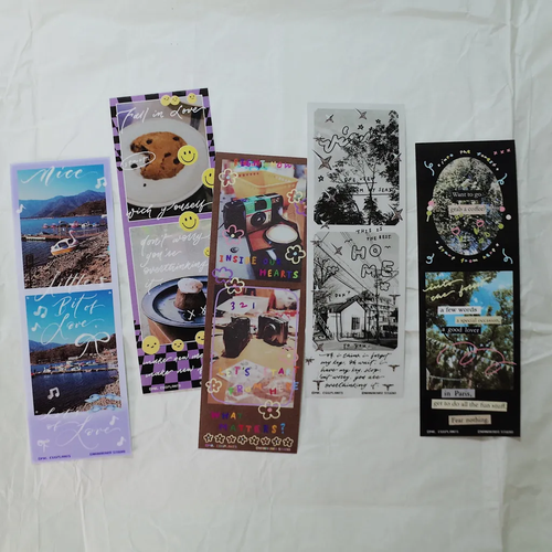 Mr. Eggplants Photo Booth Sticker Set featuring two vertical glossy sticker strips with vintage frame designs and colorful borders. Lot de stickers "Photo Booth" Mr. Eggplants comprenant deux bandes d'autocollants brillants verticaux avec des motifs de cadres vintage.