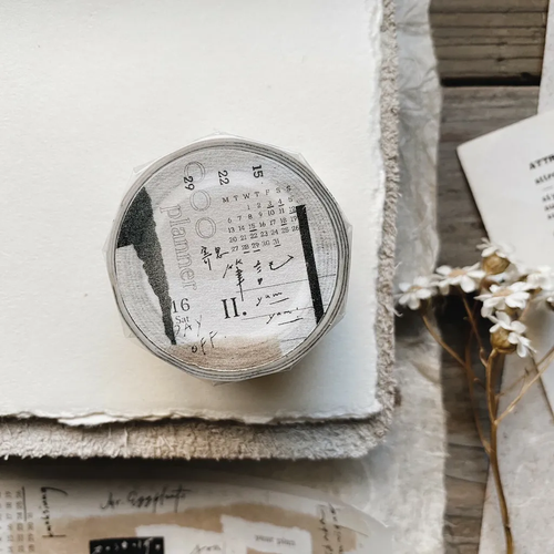 Mr. Eggplants Think Note II Washi Tape, 2.5cm wide, featuring a collage-style design with paint splashes, torn paper textures, and artistic doodles on Japanese washi paper. Ruban adhésif washi Mr. Eggplants "Think Note II", 2,5 cm de large, avec un design de style collage comprenant des éclaboussures de peinture et des textures de papier déchiré.