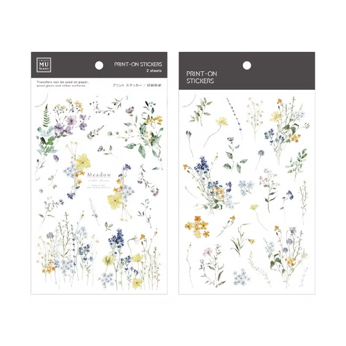 MU Print-On Sticker 277 Meadow. A set of 2 transfer sticker sheets featuring long-stemmed meadow flowers and airy botanical sprigs for journaling. Autocollants MU Print-On 277 Meadow. Lot de 2 feuilles de décalcomanies avec des fleurs des champs à longues tiges et des motifs botaniques pour l'agenda.