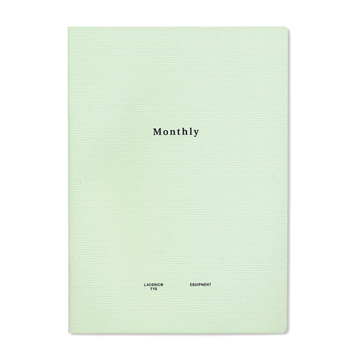 LACONIC Style Notebook A5 Monthly edition. A minimalist cream notebook showing an open undated two-page monthly calendar spread with a Monday start, blank grid notes margins, and graph paper in the back. / Carnet de bord LACONIC Style Notebook A5 Édition Monthly. Un planificateur mensuel minimaliste beige présentant un calendrier non daté sur deux pages commençant le lundi, doté de marges de notes et de pages quadrillées à la fin.