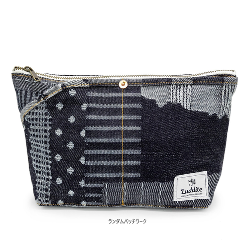 Luddite Denim Boat Pouch M in Random Patchwork theme, showing a medium-sized canvas utility bag made of various unique blue Japanese Okayama denim textures. / Trousse bateau en jean Luddite Denim Boat Pouch M, motif Random Patchwork, montrant une pochette utilitaire de taille moyenne fabriquée à partir de diverses textures uniques de denim japonais Okayama bleu.