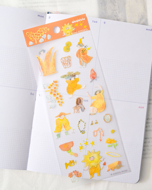 dodolulu Matte Sticker Sheet The Sun-kissed featuring radiant golden hour elements and cheerful sunlit illustrations. / Planche d'autocollants mats dodolulu The Sun-kissed présentant des éléments radieux de l'heure dorée et des illustrations ensoleillées.