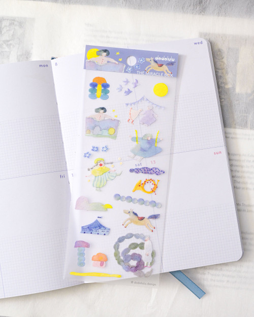 dodolulu Matte Sticker Sheet The Miracle Box featuring nostalgic childhood toys and whimsical discoveries. / Planche d'autocollants mats dodolulu The Miracle Box présentant des jouets d'enfance nostalgiques et des découvertes fantaisistes.