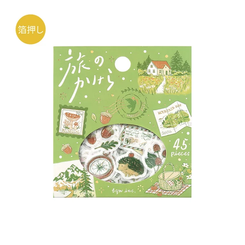 BGM Piece of The Journey Sticker Set To The Forest. A foil-stamped flake pack of 45 forest-journey stickers (15 designs × 3) in a 90 × 100 mm sleeve. Set d’autocollants BGM Piece of The Journey To The Forest. 45 stickers voyage en forêt dorés (15 motifs × 3), pochette 90 × 100 mm.