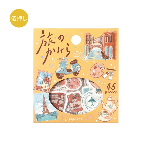 BGM Piece of The Journey Sticker Set To The World. A foil-stamped flake pack of 45 world-travel stickers (15 designs × 3) in a 90 × 100 mm sleeve. Set d’autocollants BGM Piece of The Journey To The World. 45 stickers voyage dans le monde dorés (15 motifs × 3), pochette 90 × 100 mm.