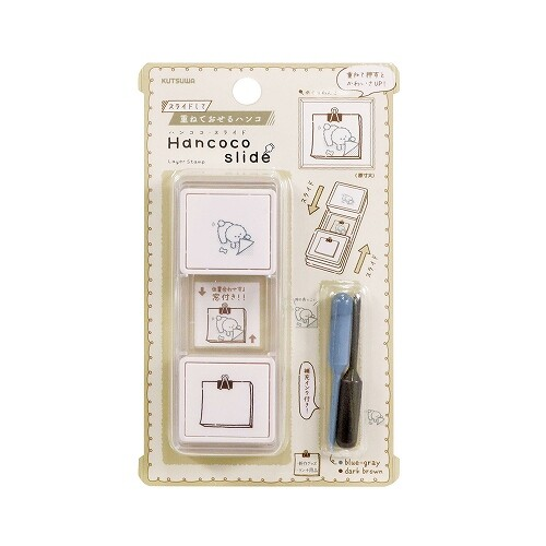 Kutsuwa Hancoco Slide Stamp Page-Turning Dog. An 80 × 30 × 15 mm two-colour slide stamp of a dog turning a page. Tampon Kutsuwa Hancoco Slide Chien qui tourne la page. Tampon coulissant deux couleurs 80 × 30 × 15 mm.
