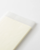 MD Notebook Diary 2027 A5 featuring minimal monthly grid spreads and cream fountain-pen-friendly MD paper. / Agenda MD Notebook Diary 2027 A5 présentant des aperçus mensuels minimalistes et du papier crème MD compatible avec les stylos-plumes.