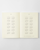 MD Notebook Diary 2027 A5 featuring minimal monthly grid spreads and cream fountain-pen-friendly MD paper. / Agenda MD Notebook Diary 2027 A5 présentant des aperçus mensuels minimalistes et du papier crème MD compatible avec les stylos-plumes.