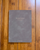 Faded Chronicle 2027 Chronicle Planner B6 Compact edition showing a collection of its 10 unique cover options with an open view of its lay-flat ink-friendly pages. Agenda Faded Chronicle 2027 Chronicle Planner Édition B6 Compact, présentant ses 10 options de couverture uniques et ses pages intérieures plates adaptées aux stylos plume.