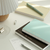 ICONIC 2027 Solitude Diary minimalist Korean planner flat lay with pen holder. / Agenda ICONIC 2027 Solitude Diary carnet coréen minimaliste reliure à plat.