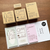 A Stamp Marche rubber stamp (b-470) designed for life logging, featuring minimal log icons for tracking sleep, mood, weather, temperature, weight, and water intake. Un tampon en caoutchouc Stamp Marche (b-470) conçu pour le journal de vie, avec des icônes minimales pour suivre le sommeil, l'humeur, la météo, la température, le poids et l'hydratation.