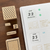 A set of 12 individual rubber stamps (b-242) for journaling, featuring the names of the months in a handwritten-style English font.  Un ensemble de 12 tampons en caoutchouc individuels (b-242) pour l'agenda, présentant les noms des mois en anglais et dans une police manuscrite.