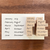 A set of 12 individual rubber stamps (b-242) for journaling, featuring the names of the months in a handwritten-style English font.  Un ensemble de 12 tampons en caoutchouc individuels (b-242) pour l'agenda, présentant les noms des mois en anglais et dans une police manuscrite.