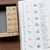 A set of 5 small, square rubber stamps (a-209) designed by Peppoko, featuring weather icons: sun, cloud, rain, snow, and wind. Un ensemble de 5 petits tampons carrés en caoutchouc (a-209) conçus par Peppoko, avec des icônes météo : soleil, nuage, pluie, neige et vent.