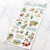 Mind Wave Chic Mignon Sticker sheet (Gardening design) featuring various botanic illustrations, potted plants, and gardening tools with gold foil accents on translucent tracing paper material. Feuille d'autocollants Mind Wave Chic Mignon (motif Jardinage) illustrant des éléments botaniques, des plantes en pot et des outils de jardinage avec des touches de dorure à chaud sur papier calque (végétal) translucide.