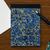 attaché Letterpress Memo Pad A5 in Blue, featuring a vintage marble pattern cover and hand-pressed grid sheets on premium OK Fools paper. Bloc-notes attaché Letterpress A5 bleu, avec une couverture au motif marbré vintage et des feuilles quadrillées pressées à la main sur papier OK Fools.