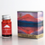 Teranishi Mt. Fuji Fountain Pen Ink in Akane Red. A 12ml glass bottle of vibrant vermillion ink with a red Mt. Fuji illustration on the label. Encre pour stylo-plume Teranishi Mt. Fuji en Akane Rouge. Un flacon de 12 ml d'encre vermillon éclatante avec une illustration du Mont Fuji rouge sur l'étiquette.