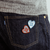 THE SUPERIOR LABOR "TSL Patch - Heart." A small embroidered heart patch available in red or blue, designed for customizing bags and gear. Écusson "TSL Patch - Heart" par THE SUPERIOR LABOR. Un petit patch brodé en forme de cœur disponible en rouge ou bleu pour personnaliser sacs et vêtements.