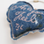 THE SUPERIOR LABOR Denim Charm. A miniature decorative charm made from indigo or washed denim with metal hardware. Charm en denim THE SUPERIOR LABOR. Un petit charm décoratif fabriqué en denim indigo ou délavé avec des attaches en métal.
