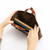 THE SUPERIOR LABOR All Leather Mini Bag. A small, premium leather tote bag with a minimalist design and brass hardware, available in two colors. Mini sac tout cuir THE SUPERIOR LABOR. Un petit sac cabas en cuir haut de gamme au design minimaliste avec détails en laiton, disponible en deux couleurs.