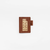 THE SUPERIOR LABOR A6 Note Keeper - Chocolate. A handcrafted leather notebook cover designed to look like a chocolate bar with a foil wrapper. Protège-carnet A6 Chocolat par THE SUPERIOR LABOR. Une couverture de carnet en cuir artisanal ressemblant à une tablette de chocolat avec emballage.