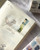 Pion Die-Cut Washi Tape - Paragraph (5cm). A roll of premium kiss-cut Japanese washi tape featuring literary paragraph segments and gourd-shaped vintage text designs on matte textured paper. Ruban washi découpé Pion - Paragraph (5cm). Un rouleau de ruban washi japonais premium kiss-cut avec segments de paragraphes littéraires et motifs en forme de calebasse sur papier texturé mat.