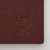 TAKEO PAPER Dressco Stitch Notebook Maroon edition. A slim, palm-sized notebook featuring a leather-textured maroon paper cover, stitched spine, and premium blank Bank Paper pages embedded with a Three Diamonds watermark. / Carnet cousu TAKEO PAPER Dressco Édition Maroon. Un carnet de poche mince arborant une couverture en papier bordeaux texture cuir, une reliure cousue et des pages blanches en papier de banque haut de gamme.