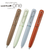 A compact uni-ball ONE 3 rotating multi-pen showing its short, thick barrel design, signature wire pocket clip, and smooth metal nose cone tip. / Un stylo rétractable compact uni-ball ONE 3 à rotation présentant son corps court et épais, son clip de poche en fil métallique emblématique et sa pointe métallique.