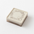 Midori pre-inked paintable stamp Bread theme in a brown square body. Shows a soft brown ink frame pattern with hand-drawn bakery motifs designed by Sayo Koizumi. / Tampon auto-encreur à peindre Midori thème Pain, boîtier carré marron. Montre un motif de cadre à l'encre marron clair avec des motifs de boulangerie conçus par Sayo Koizumi.