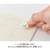 Midori Yuru Log roll sticker in Numbers theme, showing a strip of 26 unique illustrated digit designs being torn from a perforated paper roll. / Rouleau d'autocollants Midori Yuru Log thème Chiffres, montrant une bande de 26 motifs de chiffres illustrés uniques détachée d'un rouleau de papier perforé.