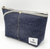 Luddite Denim Boat Pouch M in solid rigid Okayama denim from the Authentic Denim series. Compact boat-shaped design with metal zipper, internal zippered divider pocket, and vintage workwear stitching and labels. Made in Japan. Pochette bateau en denim Luddite M en denim Okayama rigide uni de la série Authentic Denim. Design compact en forme de bateau avec fermeture éclair métallique, poche intérieure zippée et détails workwear vintage (coutures et étiquettes). Fabriquée au Japon.
