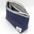 Luddite Denim Boat Pouch M in solid rigid Okayama denim from the Authentic Denim series. Compact boat-shaped design with metal zipper, internal zippered divider pocket, and vintage workwear stitching and labels. Made in Japan. Pochette bateau en denim Luddite M en denim Okayama rigide uni de la série Authentic Denim. Design compact en forme de bateau avec fermeture éclair métallique, poche intérieure zippée et détails workwear vintage (coutures et étiquettes). Fabriquée au Japon.