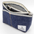 Luddite Denim Boat Pouch S in solid rigid Okayama denim from the Authentic Denim series. Compact boat-shaped design with metal zipper, internal zippered divider pocket, and vintage workwear stitching and labels. Made in Japan. Pochette bateau en denim Luddite S en denim Okayama rigide uni de la série Authentic Denim. Design compact en forme de bateau avec fermeture éclair métallique, poche intérieure zippée et détails workwear vintage (coutures et étiquettes). Fabriquée au Japon.