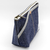 Luddite Denim Boat Pouch S in solid rigid Okayama denim from the Authentic Denim series. Compact boat-shaped design with metal zipper, internal zippered divider pocket, and vintage workwear stitching and labels. Made in Japan. Pochette bateau en denim Luddite S en denim Okayama rigide uni de la série Authentic Denim. Design compact en forme de bateau avec fermeture éclair métallique, poche intérieure zippée et détails workwear vintage (coutures et étiquettes). Fabriquée au Japon.