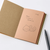 TAKEO PAPER SIKI Notebook M in Minori Harvest showcasing its unique sloped side profile featuring 48 different warm earth-toned textured paper sheets. / Carnet TAKEO PAPER SIKI Taille M thème Minori Récolte montrant son profil en biseau unique composé de 48 feuilles de papiers aux tons chauds et aux textures différentes.